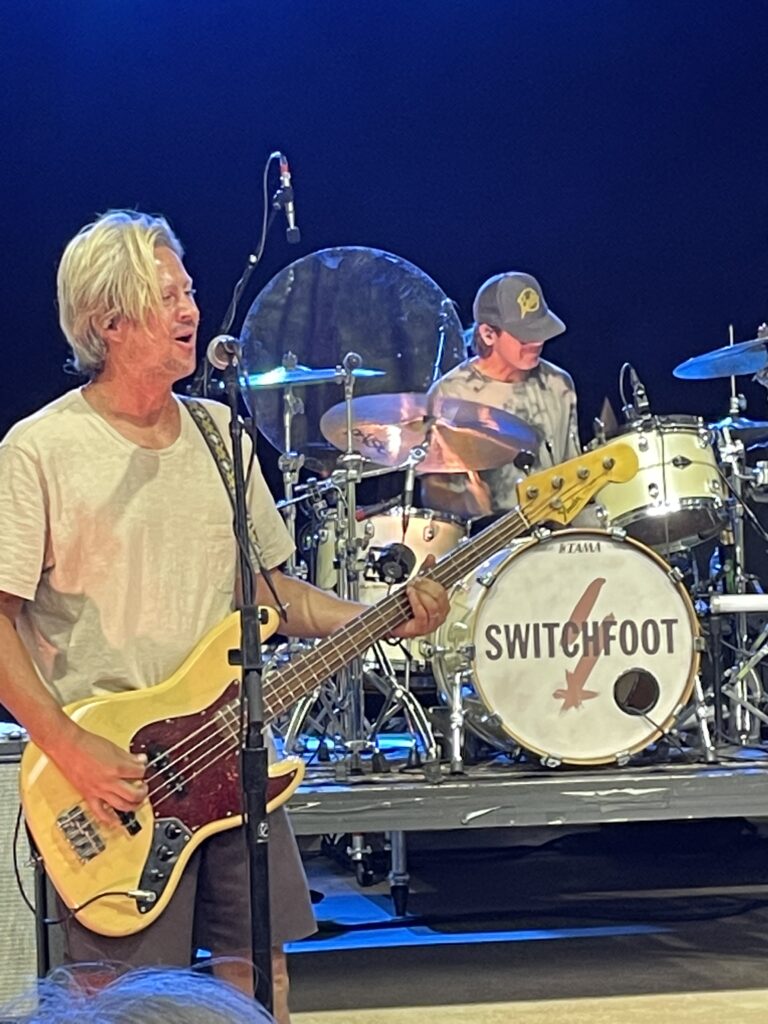 One band member on drums and on guitar